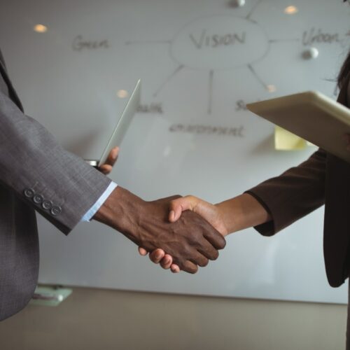 businessman-colleague-shaking-hands_107420-84915